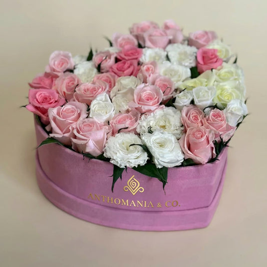 roses front view showing white and pink blooms arranged in a large pink heart shape box